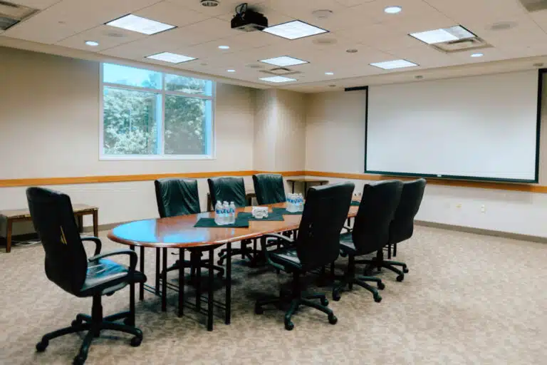 A private conference room set up for a small meeting at The Bruce.